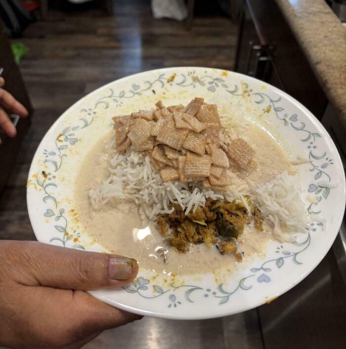 Plate of rice with cereal and sauce, depicting a cursed and disgusting food combination likely to provoke an eeeeew reaction