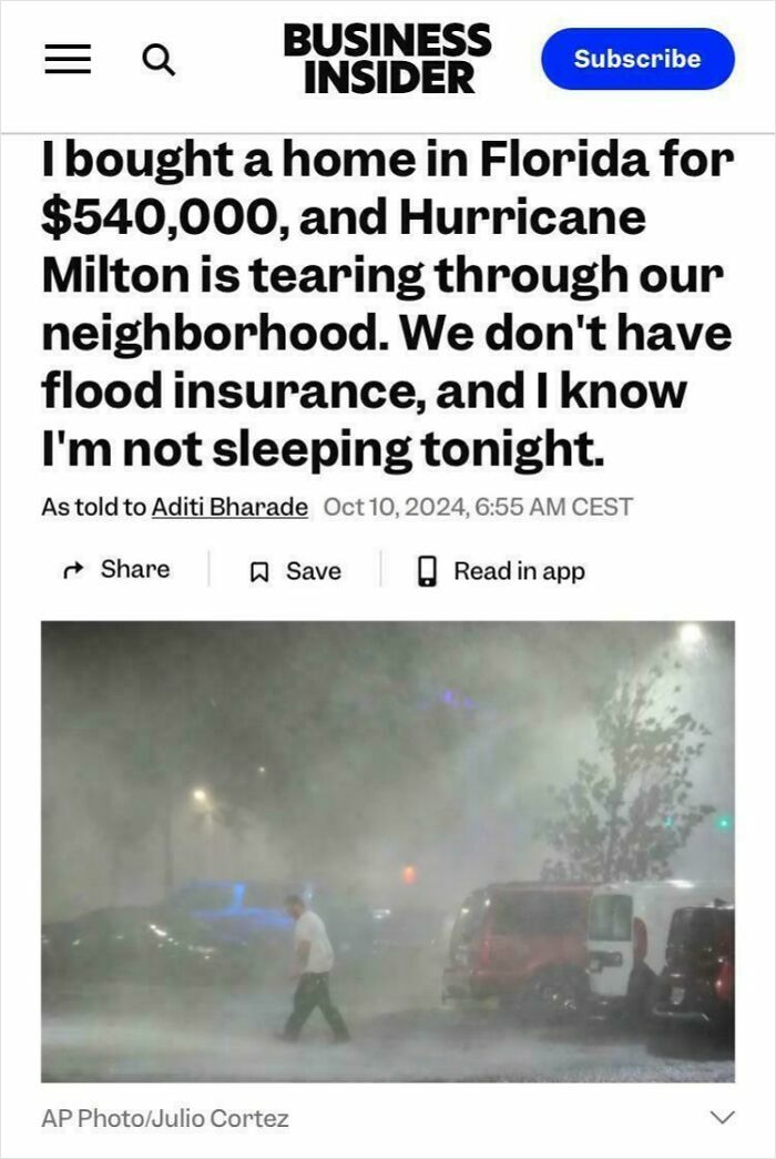 Man walking in heavy rain during Hurricane Milton, illustrating facepalm moments showing lack of basic logic and common sense.
