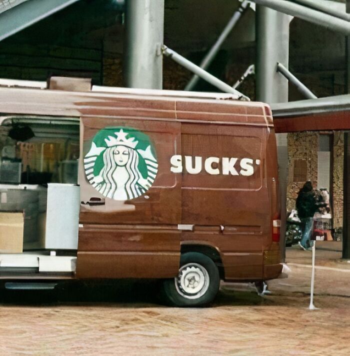 Starbucks delivery van with a humorous alteration to the logo creating accidental comedy in a seemingly harmless scene.