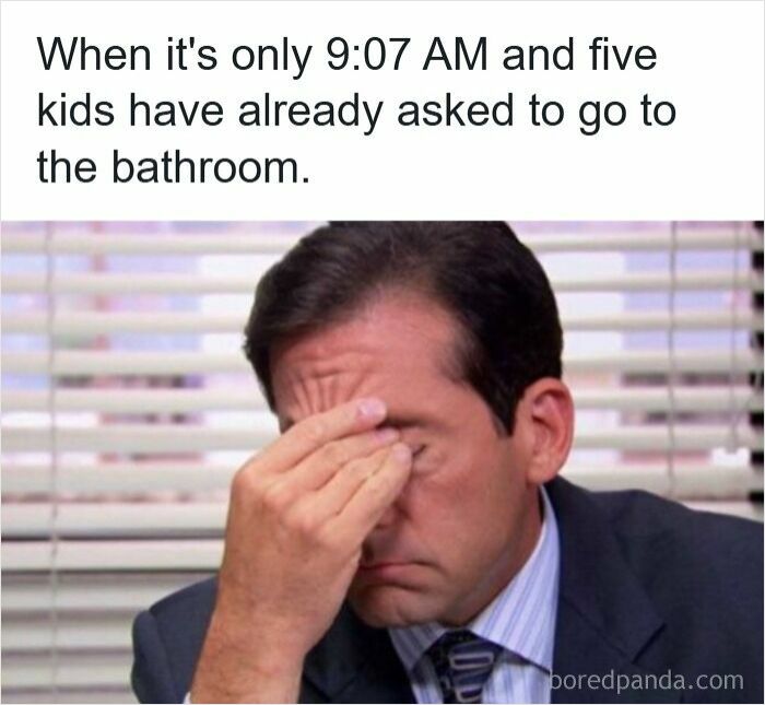Man in office suit rubbing forehead tiredly, illustrating teacher meme about early morning bathroom requests from students.