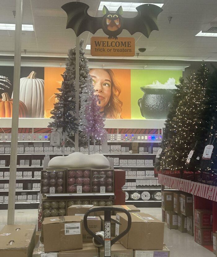 Halloween fails shown with misplaced Christmas trees and decorations in a store, confusing the spooky holiday setup.
