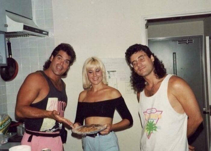 Three people in 1980s casual clothing posing indoors, showcasing the wild, weird, and wonderful style of the decade.