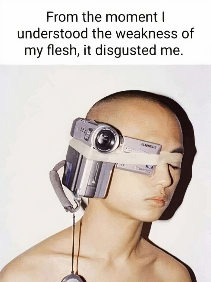 Confusing image of a person with a camcorder strapped to their head, illustrating weird and surreal visual concepts.