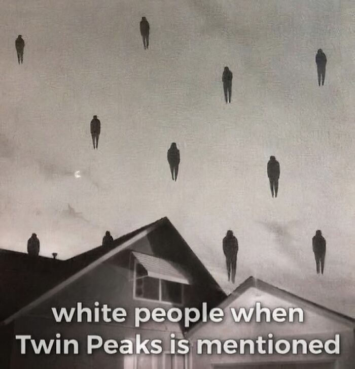 Surreal image of floating shadowy figures above rooftops, a confusing image that gets weirder the longer you look.