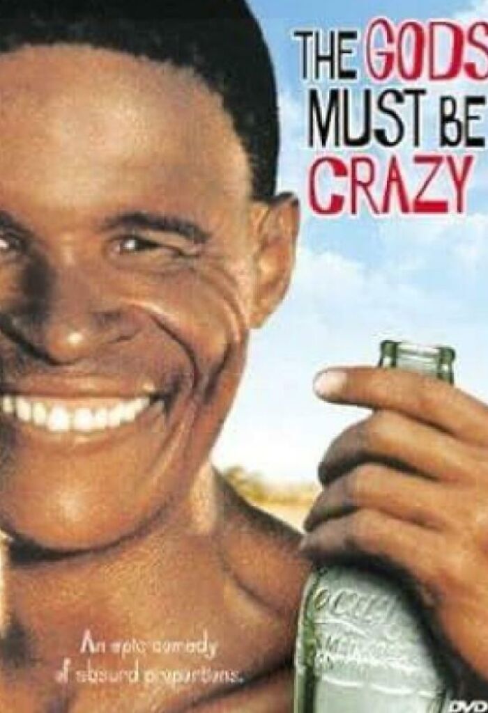 Smiling man holding a vintage Coca-Cola bottle referencing things that make people who recognize them feel very old.