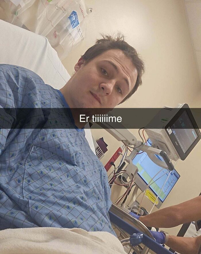 Young man in hospital gown connected to medical equipment, capturing a moment of Halloween fails and mishaps.