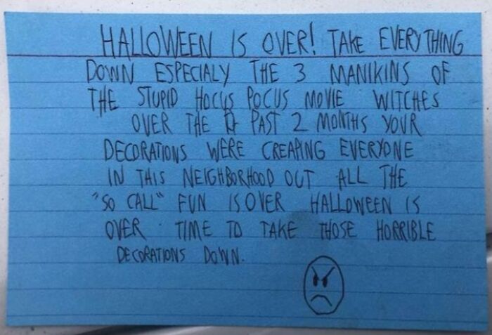 Handwritten note demanding Halloween decorations be taken down, highlighting Halloween fails and neighborhood frustration.