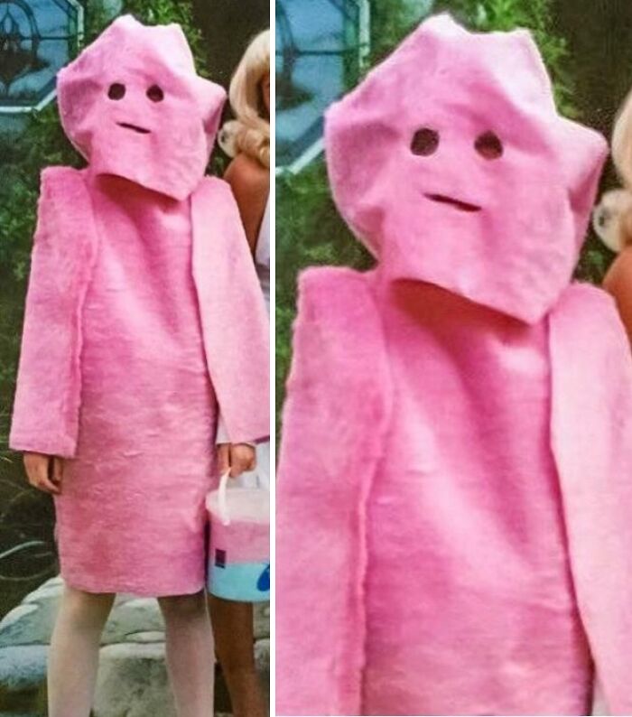 Person wearing a poorly made pink Halloween costume with simplistic facial cutouts, a clear example of Halloween fails.