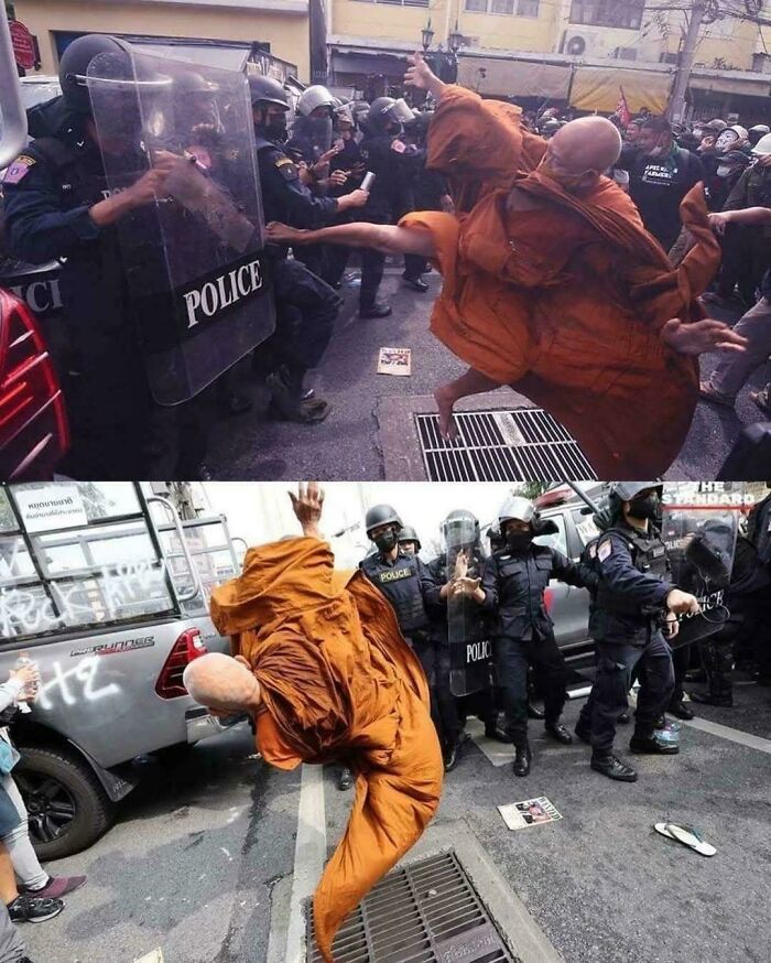 Monk in orange robe performing dynamic moves against police officers in riot gear during a street protest, humorously going hard.