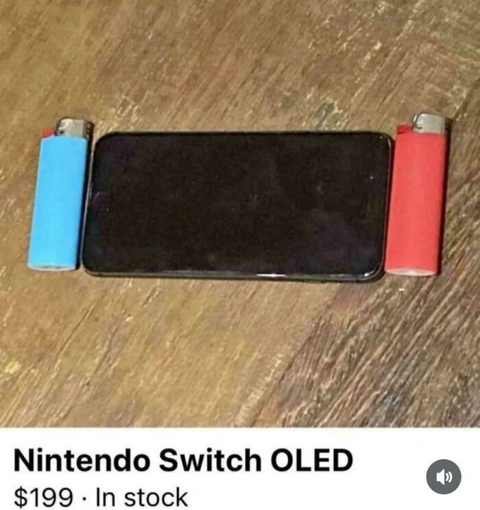 A smartphone placed between two lighters to humorously mimic a Nintendo Switch OLED console setup.