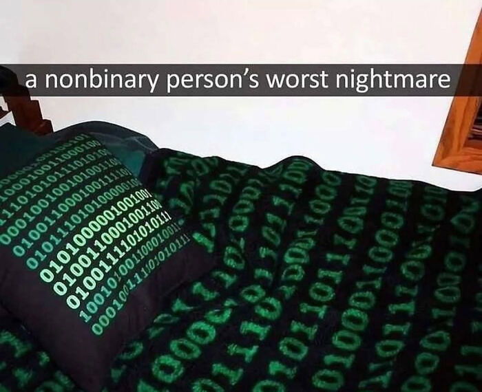 Bedding and pillow covered in green binary code, humorously labeled as a nonbinary person's worst nightmare.