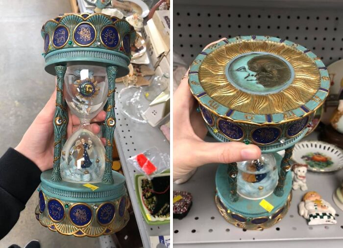 Intricately designed vintage hourglass with celestial motifs and figurine, found by lucky thrift store shoppers jackpot.