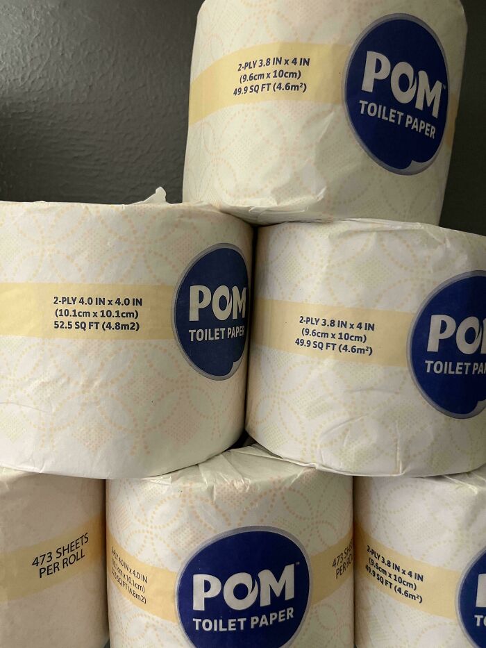 Stack of POM toilet paper rolls showing slight size and sheet count differences, illustrating sneakflation examples.