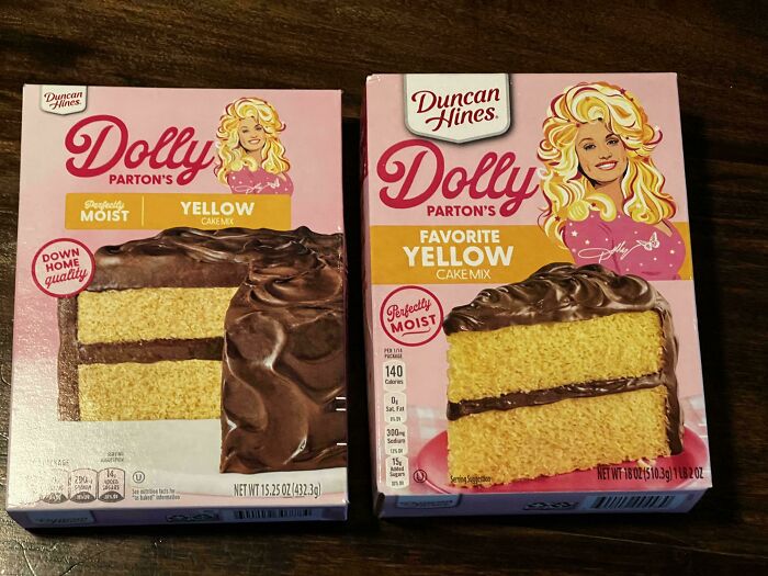 Two boxes of Dolly Parton's yellow cake mix showing sneakflation with size and packaging differences on a wooden surface.