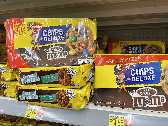 Family size Keebler Chips Deluxe cookies with M&M's and Coconut Dreams on a grocery shelf showing sneakflation packaging changes.