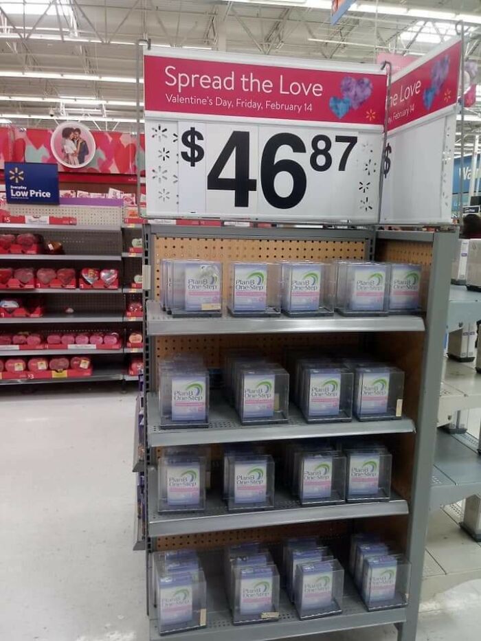 Walmart store display with multiple Plan B emergency contraceptive packs priced at $46.87 during Valentine's Day sales.