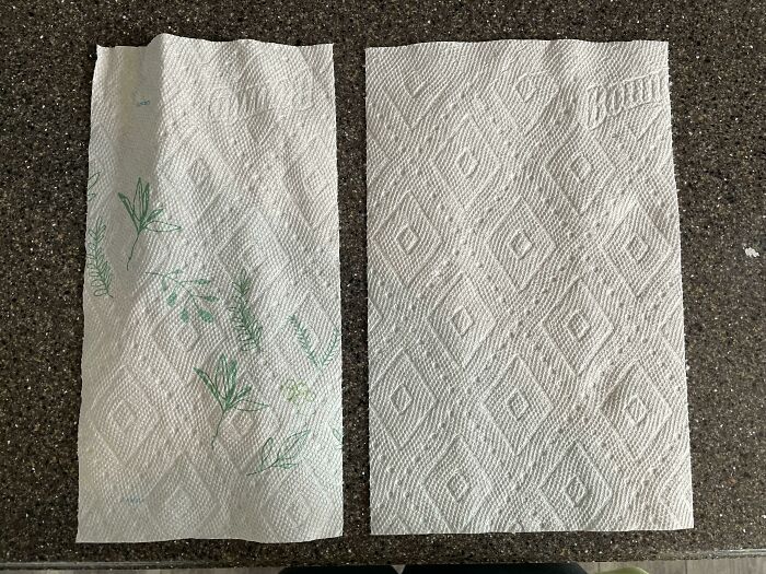Two different paper towel sheets on a countertop illustrating examples of sneakflation in everyday products.