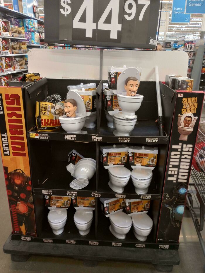 Display of novelty Skibidi Toilet toys in a Walmart aisle, showcasing unusual product selection and quirky shopping finds.