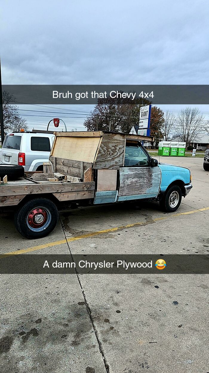 Rustic plywood truck parked in a Walmart parking lot, showcasing unique homemade modifications and creativity.