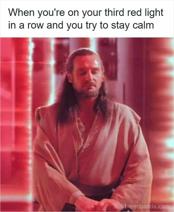 Man meditating with eyes closed, trying to stay calm at multiple red lights, illustrating driving memes and road rage frustration.