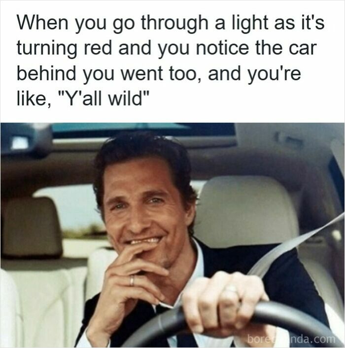 Man smiling while driving, caption about going through a red light with another car, illustrating road rage memes.