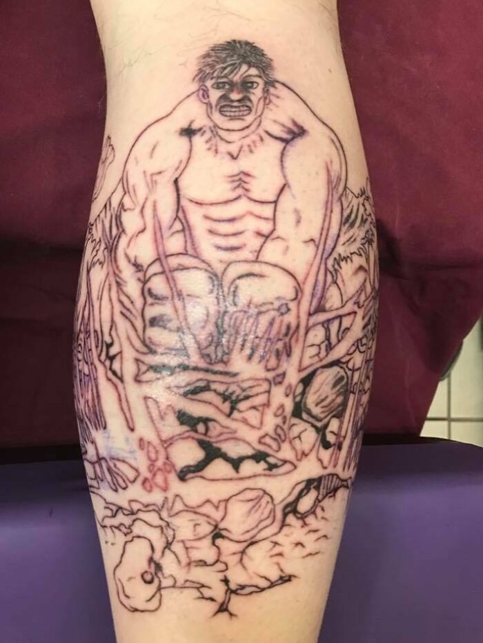 Tattoo fail of a muscular figure with distorted anatomy and unclear details on a person's leg.