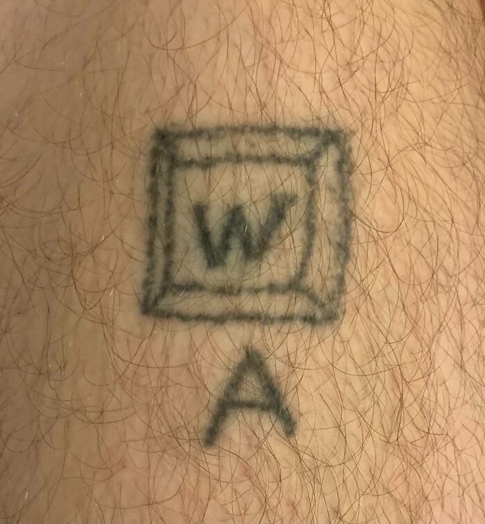 Tattoo fail of a poorly drawn word document icon and letter A on a hairy patch of skin shared for laughs.