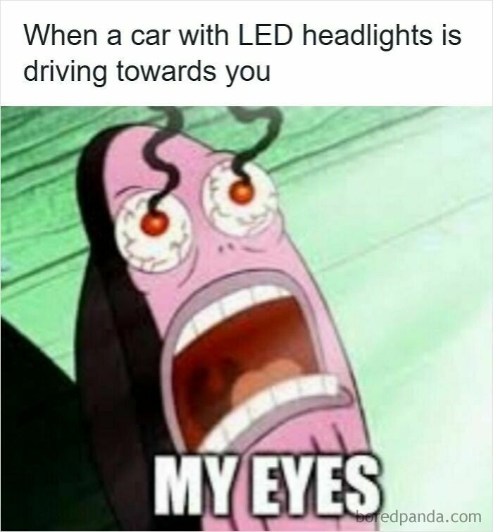 Cartoon character with glowing red eyes in pain, illustrating frustration in driving memes about road rage and bright headlights.
