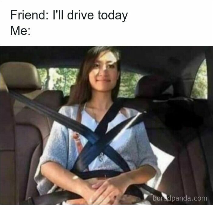 Woman sitting in car with multiple seatbelts crossed around her, a funny driving meme about road rage.