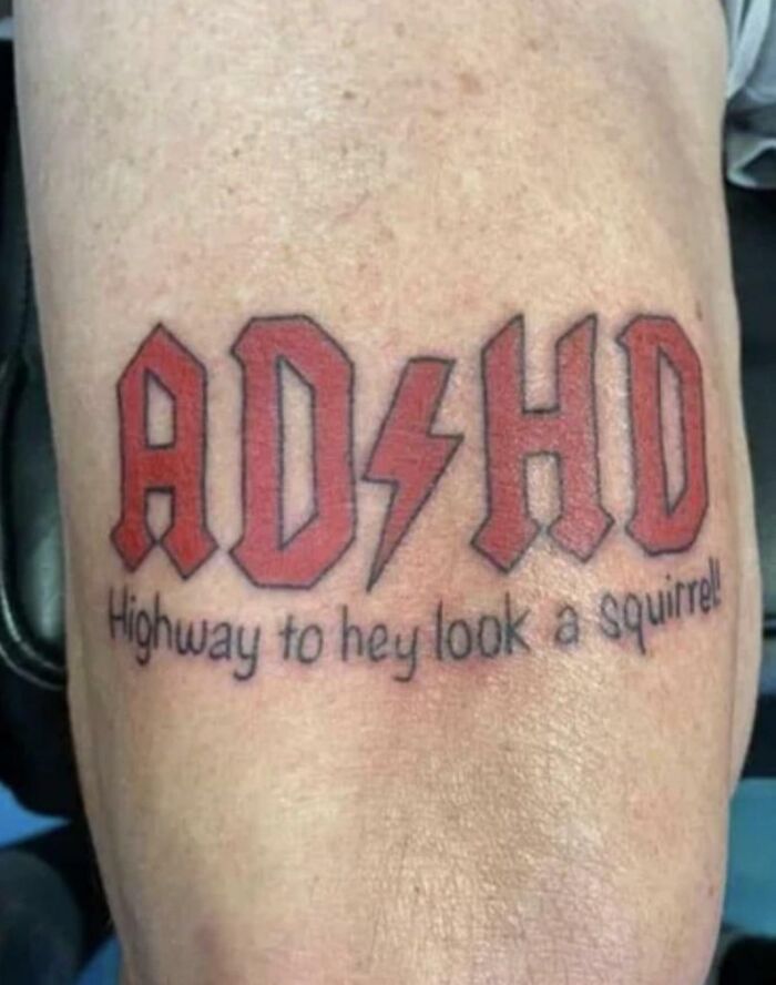 Tattoo fail showing red block letters AD/HD with a lightning bolt and text reading highway to hey look a squirrel.