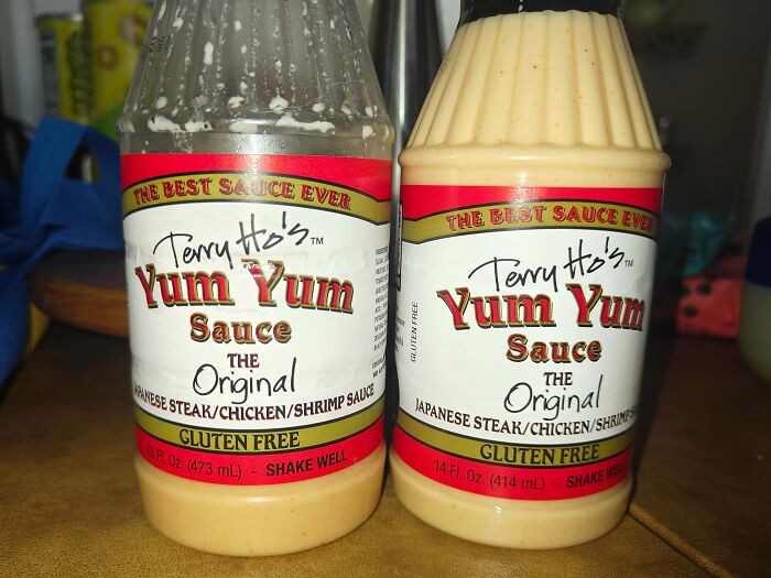 Two bottles of Terry Ho's Yum Yum Sauce labeled gluten free, illustrating an example of sneakflation in food products.