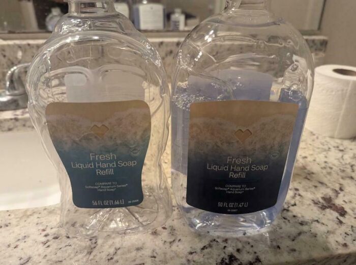 Two liquid hand soap refill bottles on a counter, showing a sneakflation example with different liquid volumes.