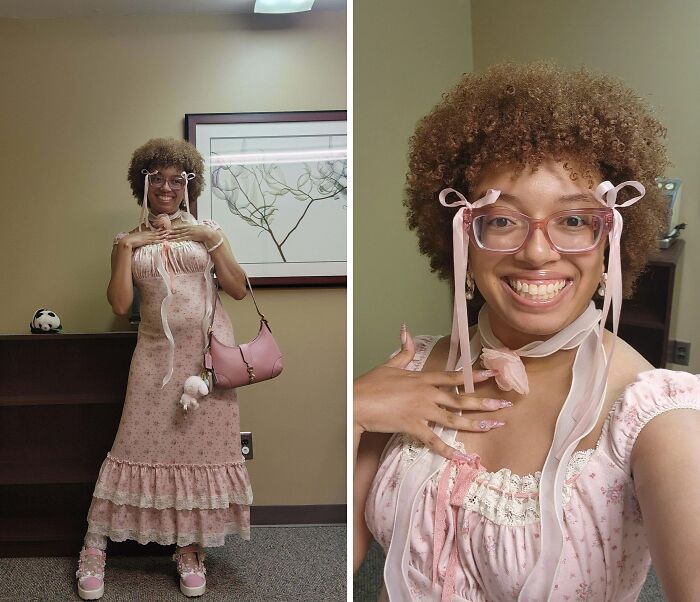 Person wearing a pastel pink dress with ribbons and accessories, showcasing cottage core aesthetics in a cozy indoor setting.