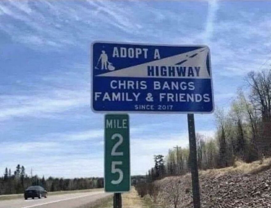 Adopt a highway sign humorously sponsored by Chris Bangs family and friends along a rural roadside.