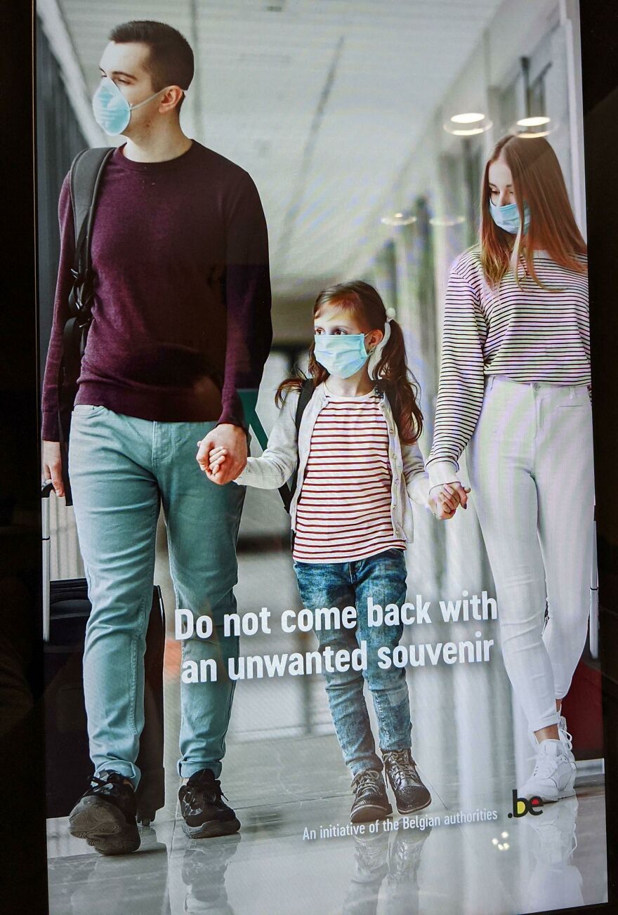 Family wearing masks walking in an airport hallway, emphasizing times people knew what they were doing and still went for it.