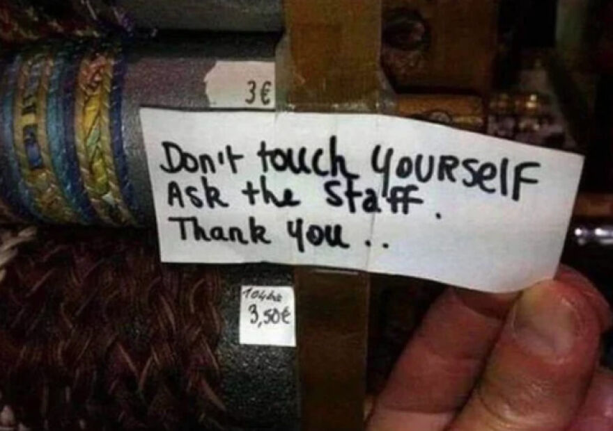 Handwritten sign on a store item saying don't touch yourself ask the staff illustrating times people knew what they were doing.