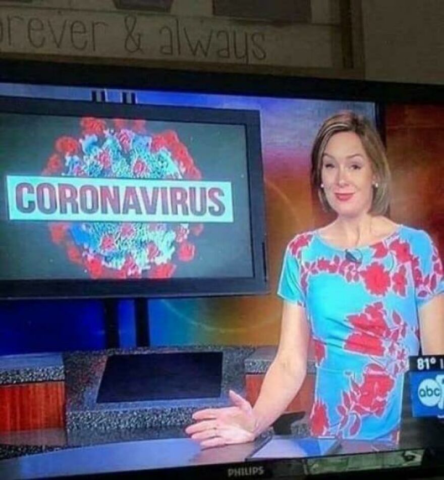 News anchor in a floral dress gesturing to a coronavirus graphic on screen, showing people knowing what they were doing.