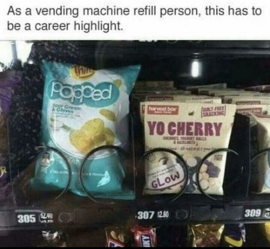 Vending machine with snack packaging humorously blocking slots, showing people knew exactly what they were doing and still went for it.