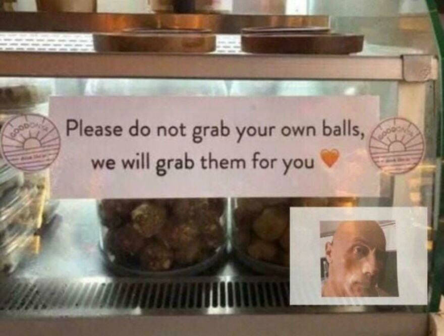 Sign at bakery with humor warning customers not to grab their own balls, showcasing times people knew exactly what they were doing.