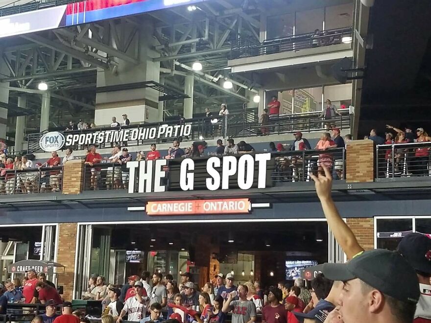 Crowd gathered at a sports venue near a sign reading THE G SPOT, showcasing moments when people knew exactly what they were doing.