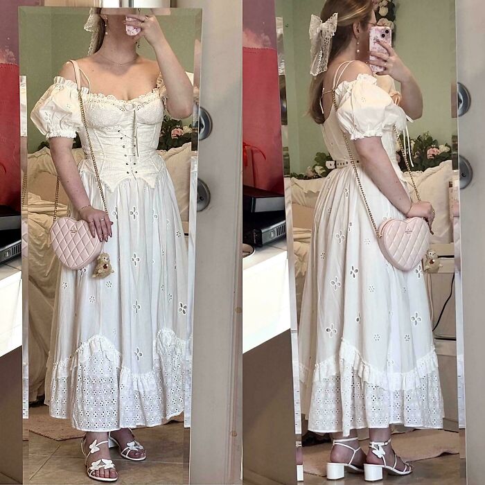 Woman wearing a white cottage core dress with puff sleeves and a heart-shaped purse, capturing cottage core aesthetics style.