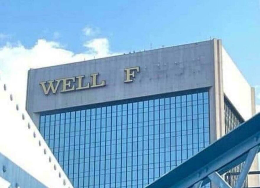 Skyscraper building with missing letters spelling well known brand, showing people knew exactly what they were doing.