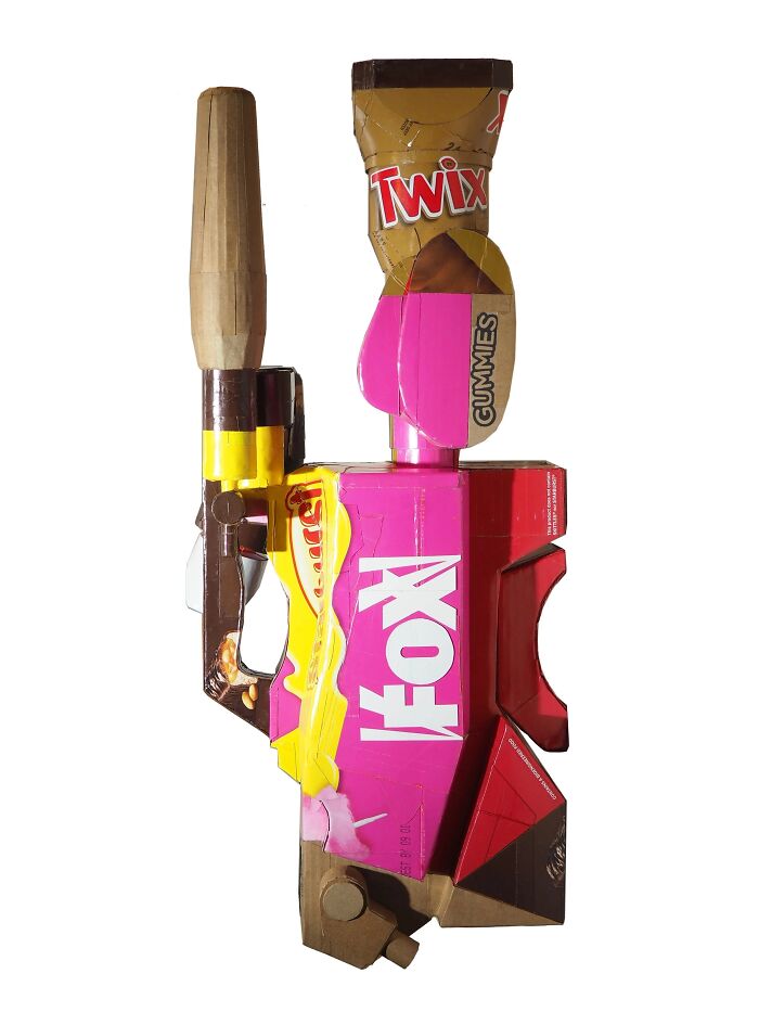 Sculpture made from waste candy packaging, showcasing artistic commentary on modern life using recycled materials.