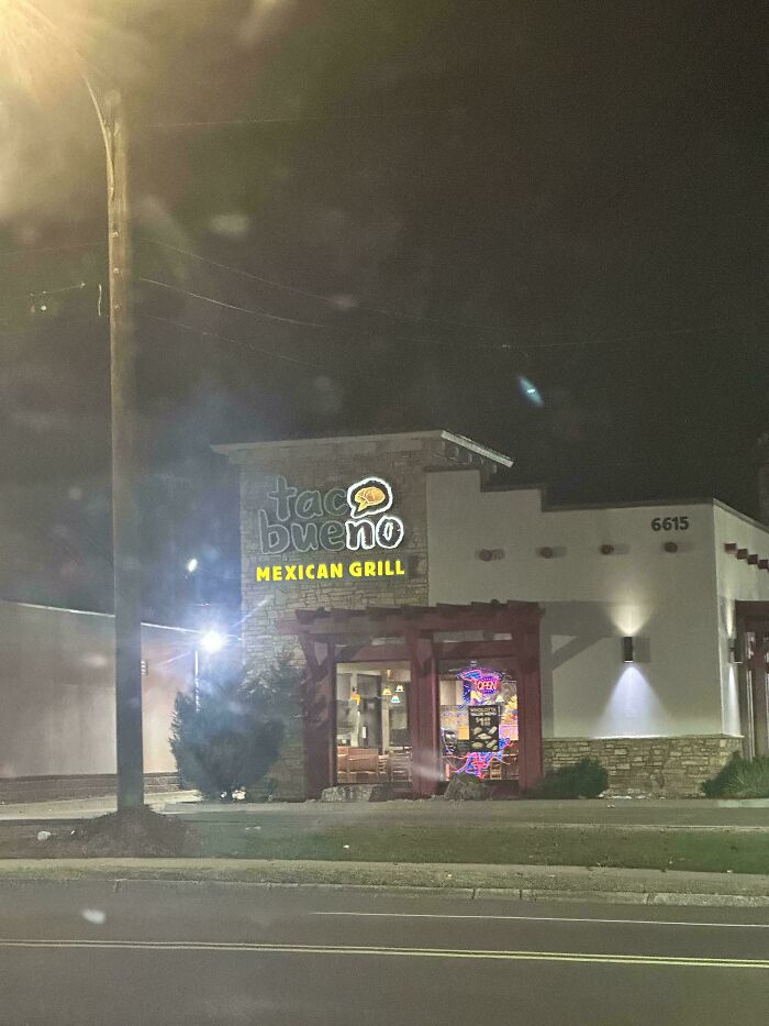 LED signs displaying Taco Bueno Mexican Grill illuminated at night on a restaurant building exterior.