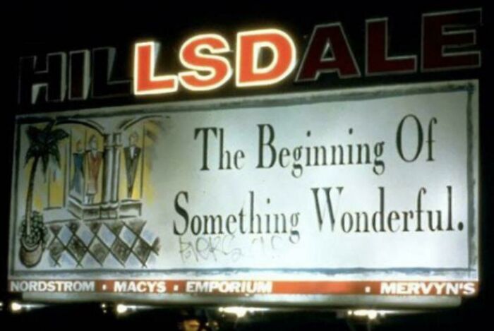 LED sign displaying the message The Beginning Of Something Wonderful with illuminated Hillsdale signage above at night.