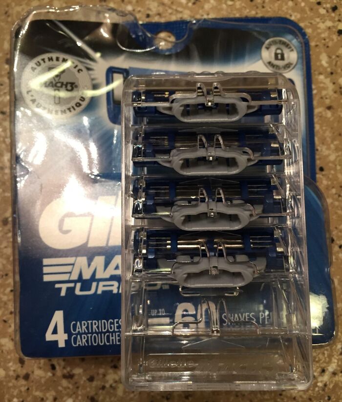 Pack of four Gillette razor cartridges in plastic casing with visible price increase as an example of sneakflation.