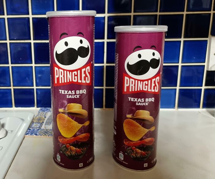 Two differently sized Pringles Texas BBQ Sauce cans on a kitchen counter illustrating sneakflation examples.