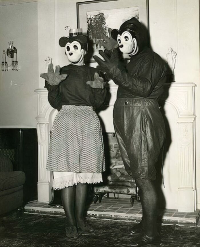 Vintage Halloween costumes from the past featuring eerie and impressive designs in a black and white photo.