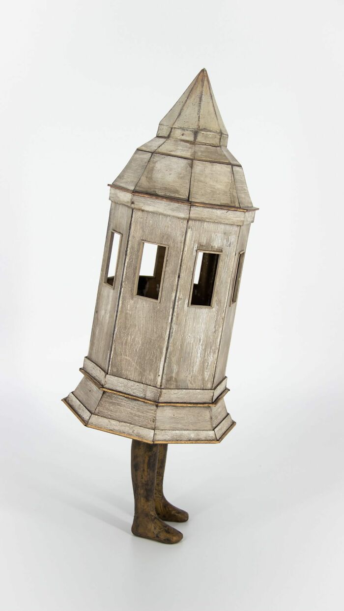 Surreal collage of a walking building with human legs, blending architecture and motion in a whimsical style.