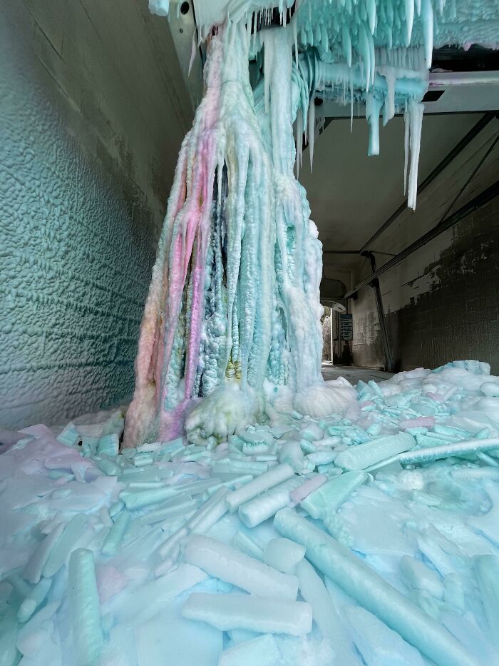 Colorful ice formations and icicles inside an abandoned building showcasing interesting pics that answer questions.